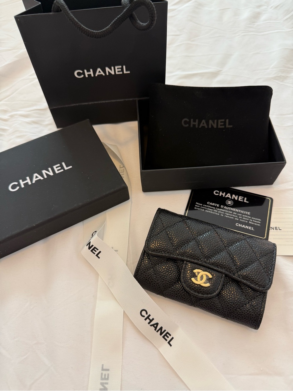 Chanel Classic Flap Card Holder in black caviar leather with gold hardware
